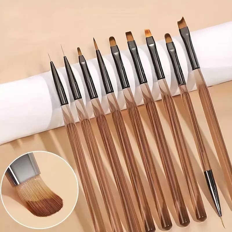 Set of nail art brushes with brown handles and black ferrules.