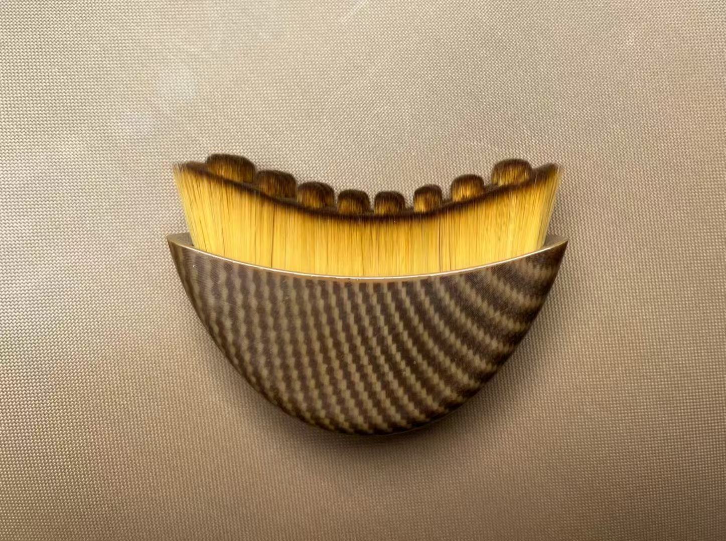 Angled foundation makeup brush with waved bristles and brown patterned handle.