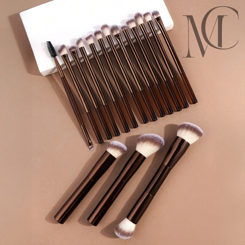 private label makeup brush set manufacturer A collection of brown-handled makeup brushes of various sizes and shapes on a beige surface.