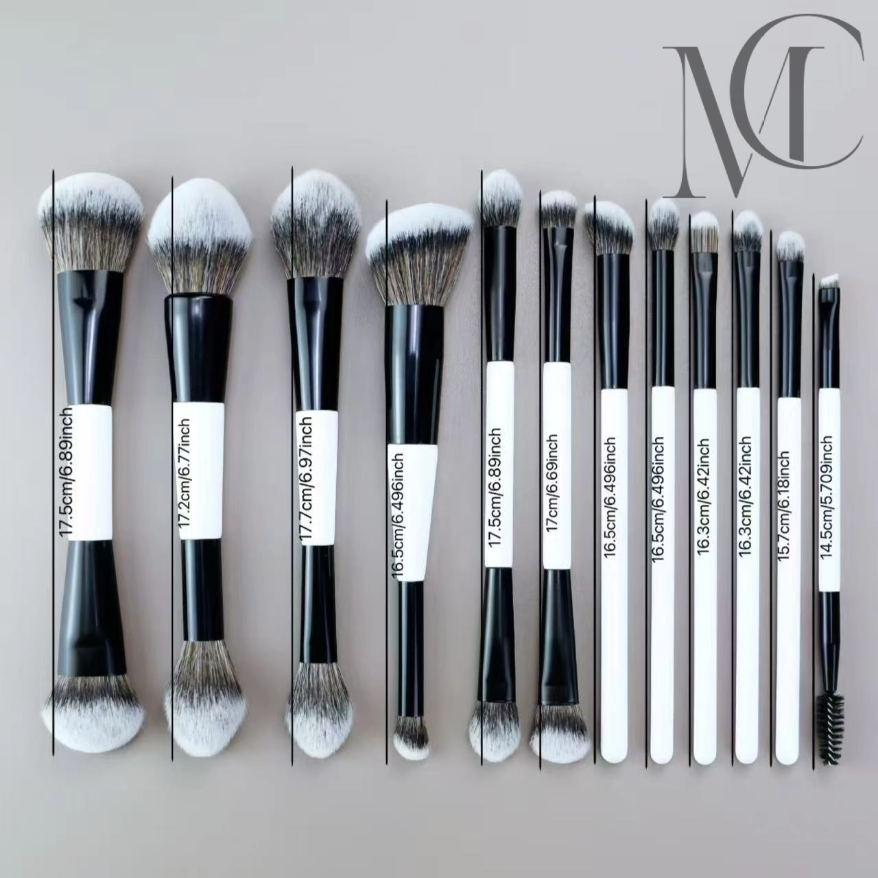 Dual-Ended Pro Makeup Brush Set A set of 12 black and white makeup brushes of various sizes and shapes.