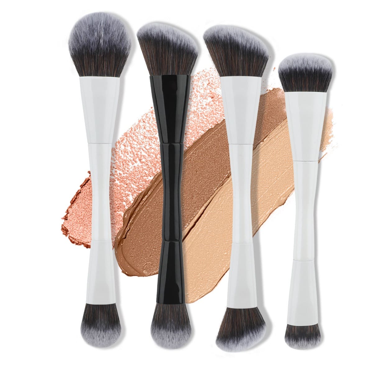 Four double-ended makeup brushes with black and white handles, on makeup swatches.